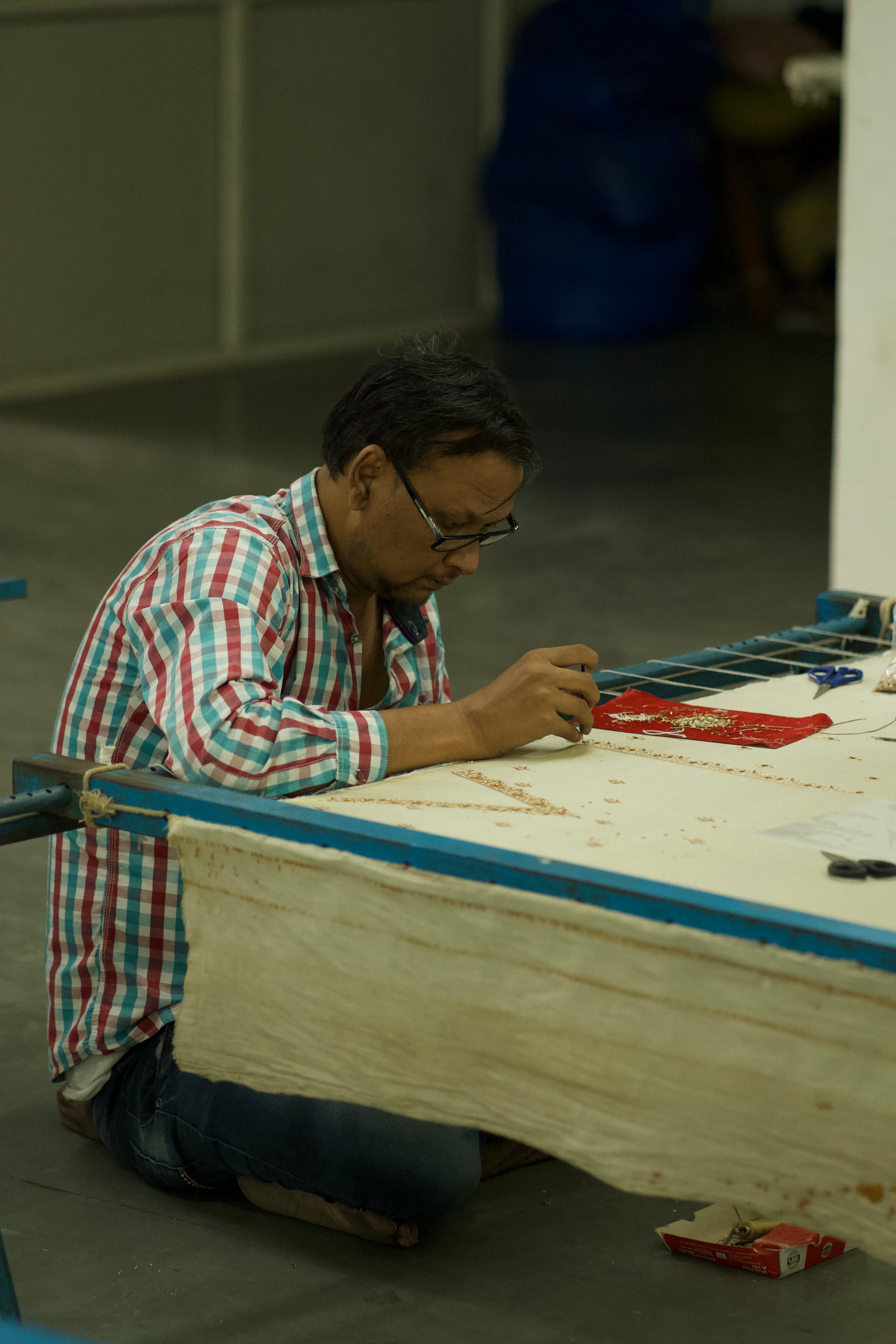 Person working on a construction project with tools and materials.